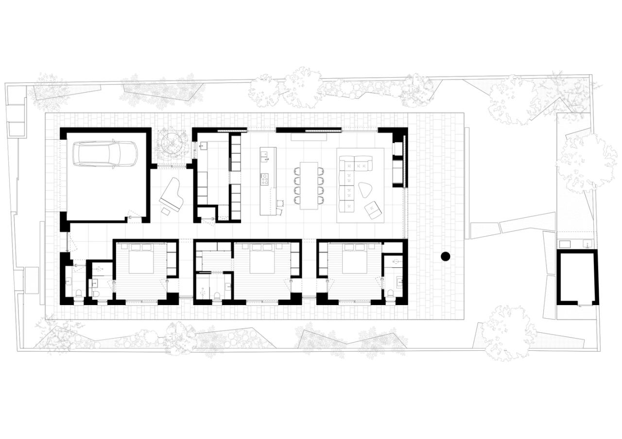 雕塑般裸露混凝土贯穿整个狭长矩形的平房设计