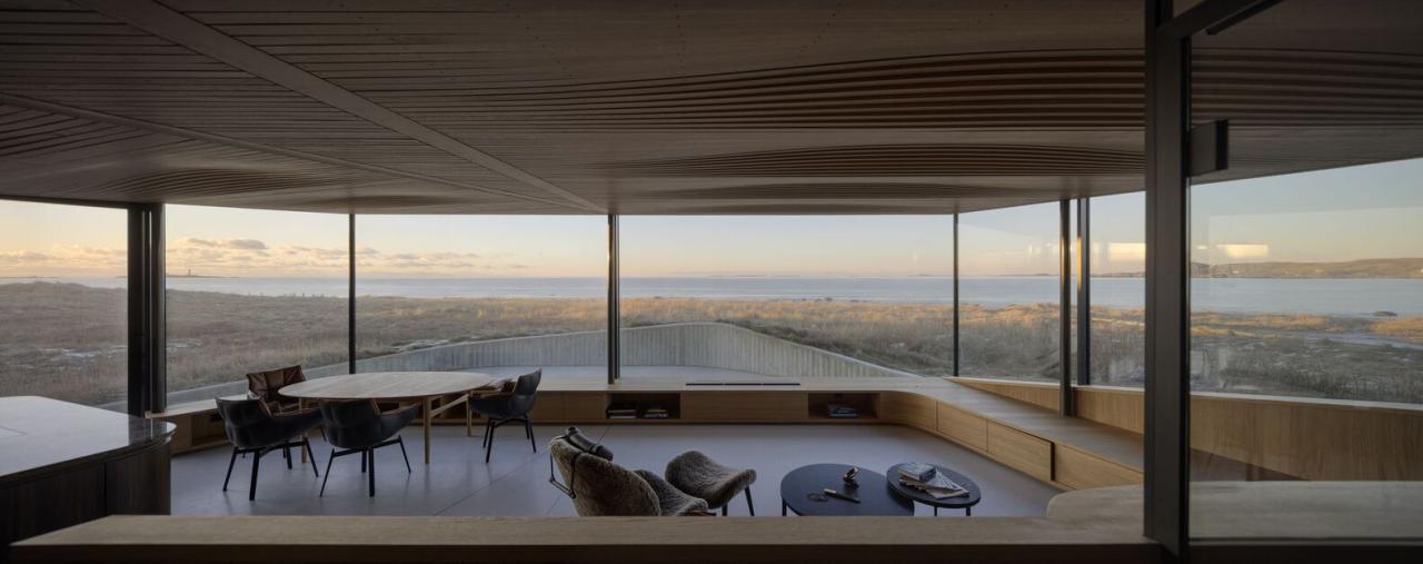 与沙丘和大海共生挪威海岸自然诗意开阔之美的度假屋设计